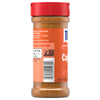 A side view of a bottle of Mccormick Perfect Pinch Cajun Seasoning Ground 5 Oz showing the nutrition facts and a list of ingredients including paprika, red pepper, garlic, and onion.