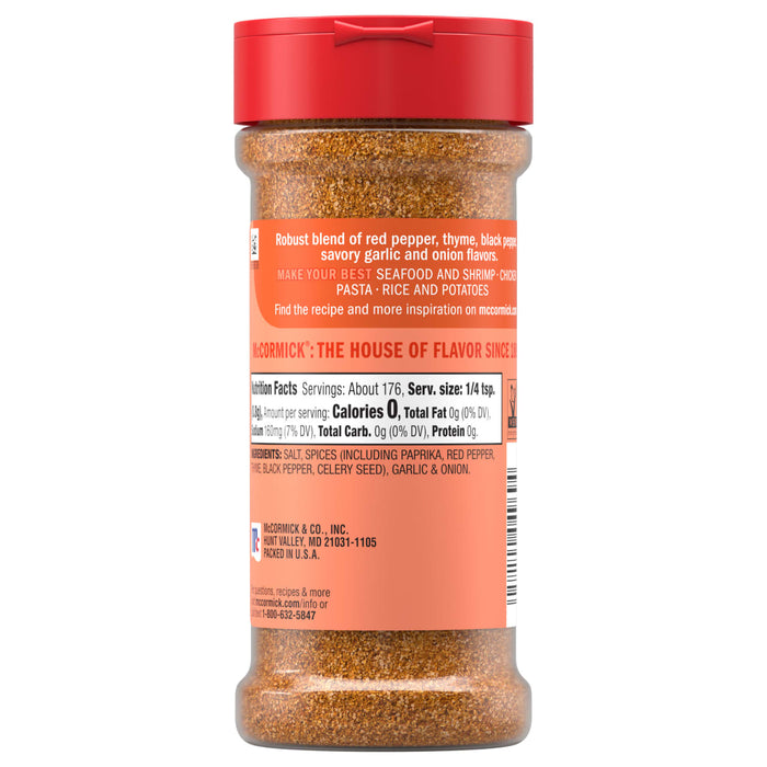 A back view of a bottle of Mccormick Perfect Pinch Cajun Seasoning Ground 5 Oz showing the nutrition facts and a robust blend of red pepper, thyme, black pepper, garlic, and onion ingredients.