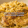 A seasoned chicken breast rests on a bed of creamy orzo pasta highlighting the pop of zesty flavor provided by Mccormick Signature Seasoning Lemon Pepper Oz.