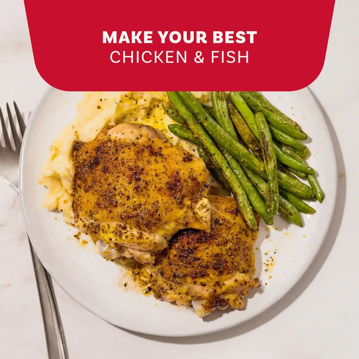 A plate of roasted chicken thighs seasoned with Mccormick Signature Seasoning Lemon Pepper Oz served alongside mashed potatoes and sautéed green beans.
