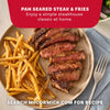 A plate of pan seared steak and fries seasoned with Mccormick Perfect Pinch Steak Seasoning Ground 7 Oz alongside a fresh salad and a fork.