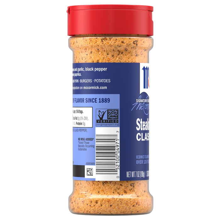 A clear bottle of Mccormick Perfect Pinch Steak Seasoning Ground 7 Oz shows the coarse blend of spices inside, with the blue label displaying the Non-GMO Project Verified seal and nutritional information.
