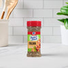 A bottle of McCormick Perfect Pinch Italian Seasoning sits on a countertop.