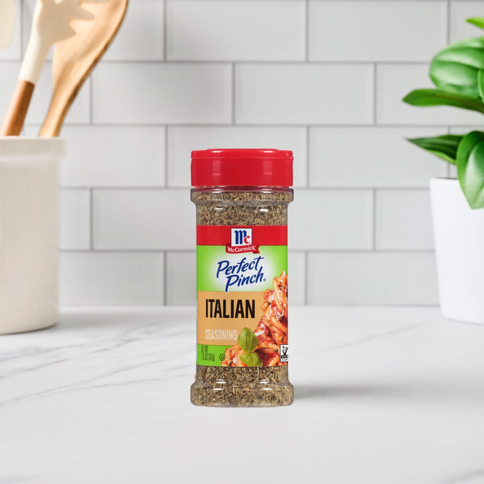 A bottle of McCormick Perfect Pinch Italian Seasoning sits on a countertop.