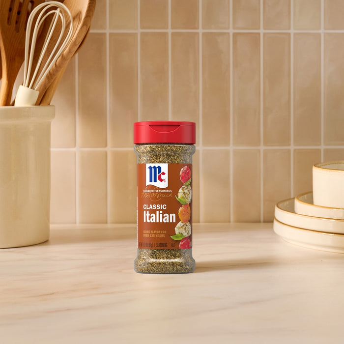 A bottle of McCormick Perfect Pinch Italian Seasoning sits on a countertop.
