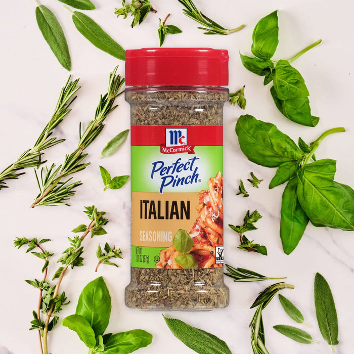 A bottle of McCormick Perfect Pinch Italian Seasoning is surrounded by fresh herbs.