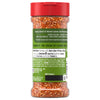 A clear plastic shaker bottle of Mccormick Perfect Pinch Salad Supreme Seasoning Assorted 4.34 Oz with a red cap, filled with orange-red seasoning, features a green and red label detailing 'FAIL-PROOF FLAVOR' and usage suggestions like 'Avocado Toast' and 'Deviled Eggs'.