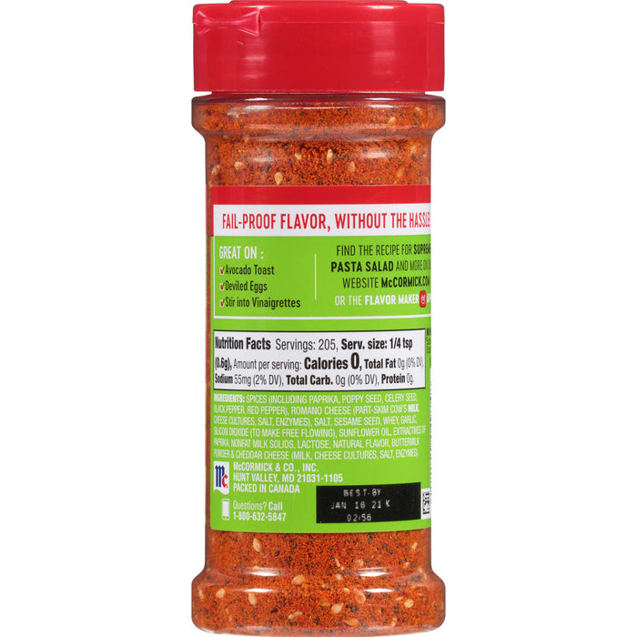 ['A McCormick Pasta Salad seasoning jar with nutritional information and a best by date.']