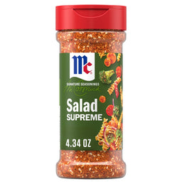 A 4.34 ounce bottle of Mccormick Signature Seasoning Salad Supreme Oz featuring a blend of paprika, poppy seeds, and celery seeds shown alongside a colorful pasta salad illustration.