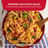 A vibrant bowl of rotini pasta salad tossed with fresh vegetables and Mccormick Signature Seasoning Salad Supreme Oz is presented as a recipe suggestion from the McCormick website.