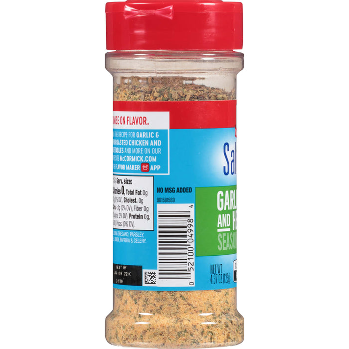 A McCormick Garlic and Herb Seasoning bottle with a red lid.