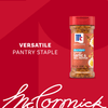A bottle of Mccormick Roasted Garlic And Red Bell Pepper Seasoning Ground 4.34 Oz is displayed against a red background as a versatile pantry staple.