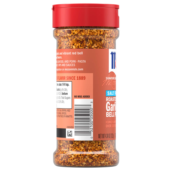 A bottle of Mccormick Roasted Garlic And Red Bell Pepper Seasoning Ground 4.34 Oz featuring a red cap and a label that highlights its salt-free recipe and vibrant blend of ingredients.