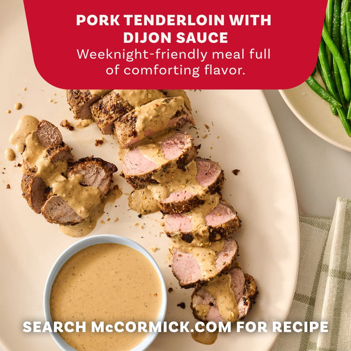 A promotional image for a pork tenderloin with dijon sauce recipe featuring sliced meat seasoned with Mccormick Onion And Herb Seasoning Crystal 4.16 Oz and served with green beans.