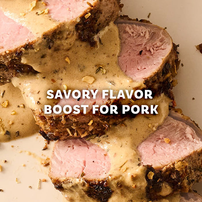 Slices of roasted pork tenderloin are drizzled with a creamy sauce prepared with Mccormick Onion And Herb Seasoning Crystal 4.16 Oz to provide a savory flavor boost.