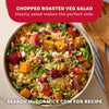 A vibrant bowl of chopped roasted veg salad featuring greens, grains, and feta cheese is showcased as a hearty side dish idea using Mccormick Vegetable Seasoning Assorted Form 4.16 Oz.