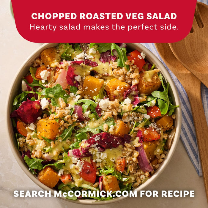 A vibrant bowl of chopped roasted veg salad featuring greens, grains, and feta cheese is showcased as a hearty side dish idea using Mccormick Vegetable Seasoning Assorted Form 4.16 Oz.