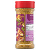 The back of a clear bottle of Mccormick Vegetable Seasoning Assorted Form 4.16 Oz shows the purple label with nutrition facts, ingredients, and a serving suggestion, topped with a red cap.