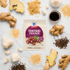 A McCormick Teriyaki Chicken seasoning packet is surrounded by fresh ingredients like ginger, garlic, and peppercorns.
