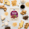 A McCormick Teriyaki Chicken seasoning packet is surrounded by fresh ingredients like ginger, garlic, and peppercorns.