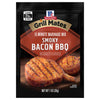 ['McCormick Grill Mates Smoky Bacon BBQ marinade mix package with a serving suggestion of grilled pork chops.']