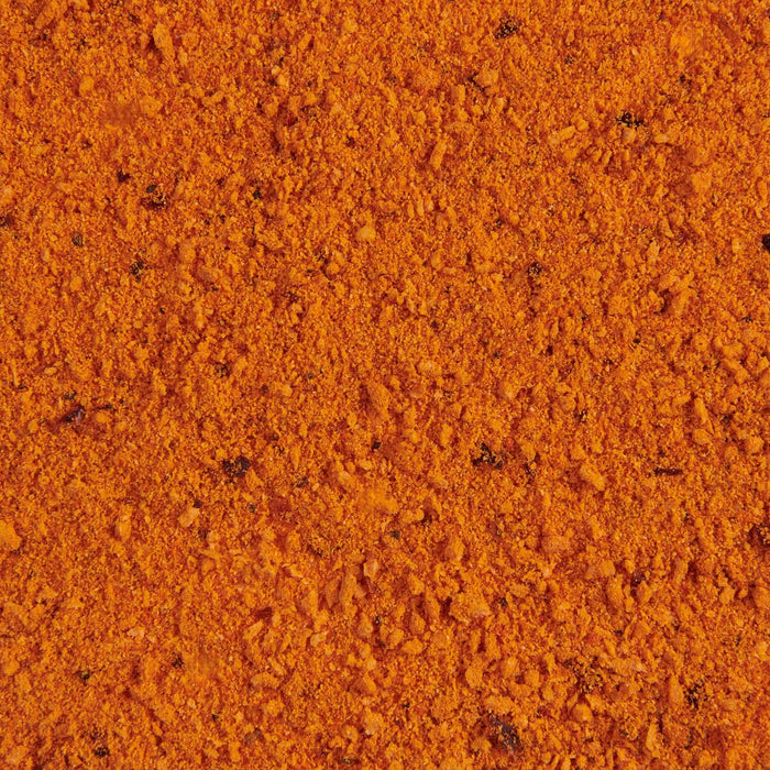 ['Close up of orange and red spices.']
