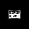 The image shows a white sign with the words SINGLE USE NO WASTE in bold black letters promoting sustainability and environmental awareness.
