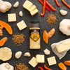 McCormick Garlic Herb seasoning is displayed among ingredients like butter, garlic, turmeric, and red peppers.