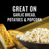 Garlic bread and popcorn are shown seasoned, illustrating the versatility of Mccormick Grill Mates Gf Garlic Butter Seasoning 3.1 Oz which is great on garlic bread, potatoes, and popcorn.