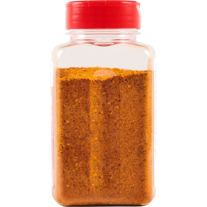 ['A clear plastic bottle with a red lid filled with a brown spice blend.']