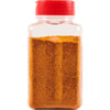 ['A clear plastic bottle with a red lid filled with a brown spice blend.']