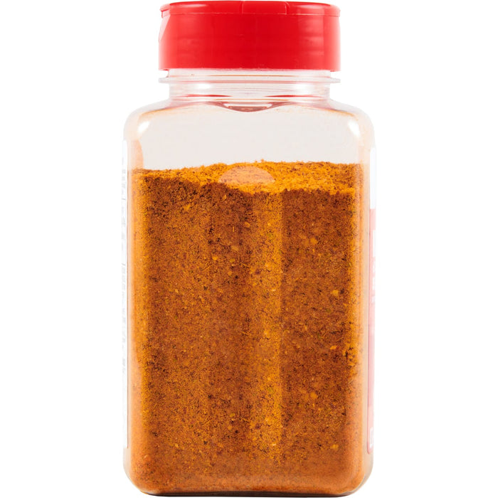 ['A clear plastic bottle with a red lid filled with a brown spice blend.']
