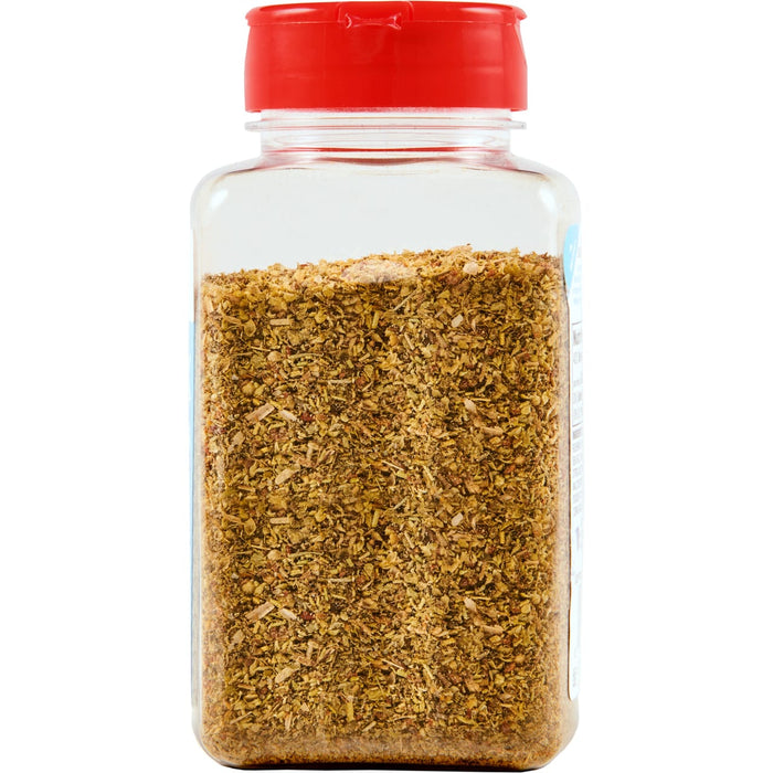 ['A glass jar with a red lid filled with dried herbs and spices.']