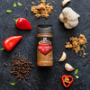 McCormick Chili Garlic seasoning is displayed with its ingredients like chili peppers, garlic, and black peppercorns.