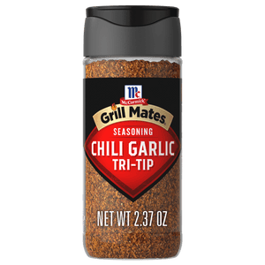 A bottle of McCormick Grill Mates Chili Garlic Tri-Tip seasoning.