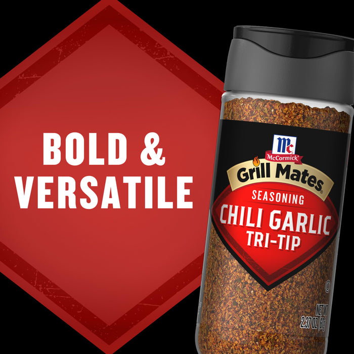 A bottle of McCormick Grill Mates Chili Garlic Tri-Tip seasoning is shown with the words Bold &amp; Versatile in the background.