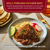 A plate of McCormick Mole Poblano Braised Beef served with rice and charred tortillas.