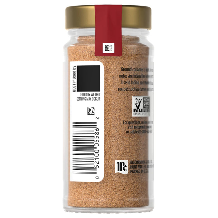 A glass jar of McCormick brand ground cumin spice.