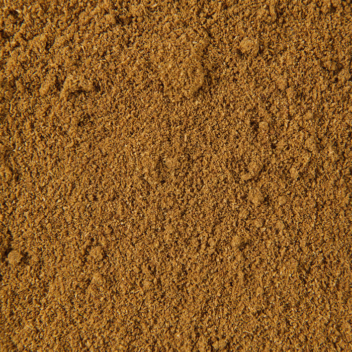 A close-up of a pile of brown, finely ground spice.