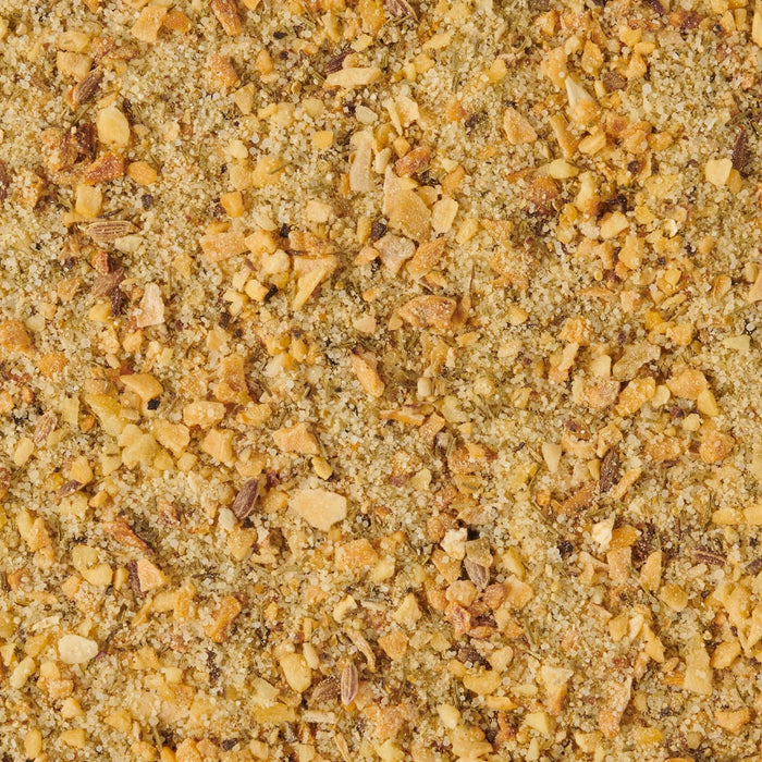 ['A close-up of a blend of dried herbs, garlic, and salt.']