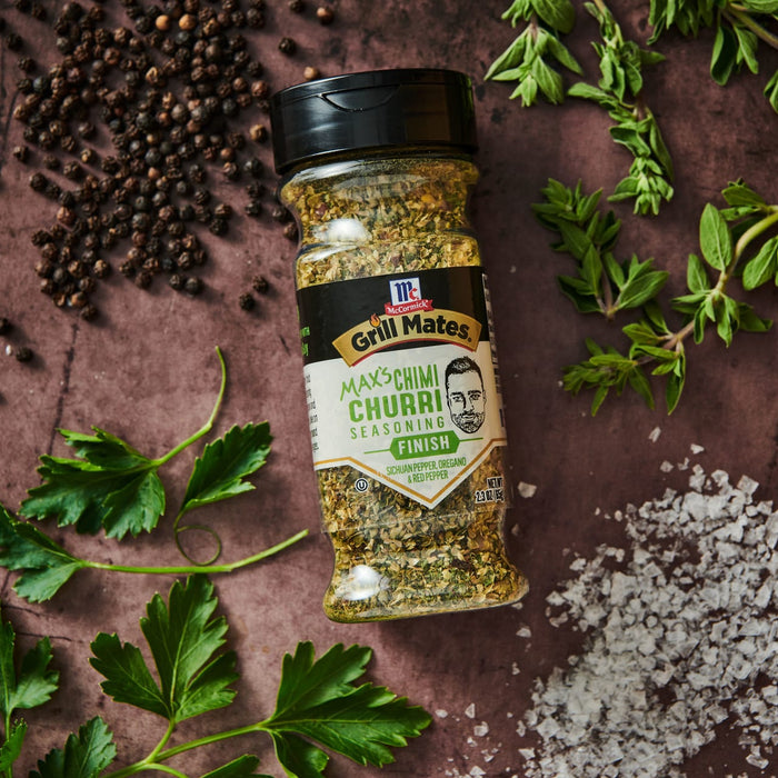 ["A bottle of McCormick Grill Mates Max's Chimi Churri Seasoning with herbs and spices."]