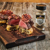 ["McCormick Grill Mates Max's All Purpose Seasoning Base is shown next to a gourmet meal of steak and puff pastry."]