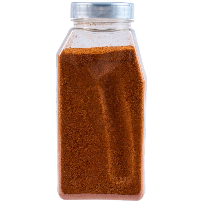 A clear plastic shaker bottle contains Mccormick Culinary Cajun Seasoning Powder 24 Oz, appearing as a reddish-brown granular spice.