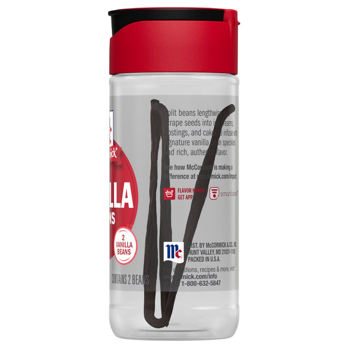 ['A McCormick Vanilla Beans jar with two vanilla beans inside.']