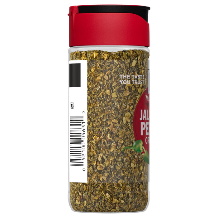 ['McCormick Jalapeno Pepper Crumbles in a glass jar with a red lid.']