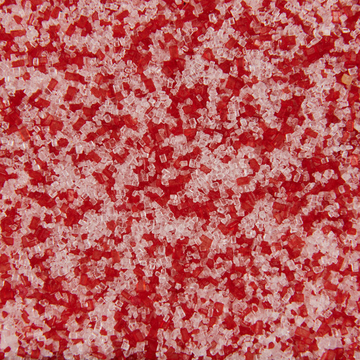 ['A close up of red and white sugar crystals.']