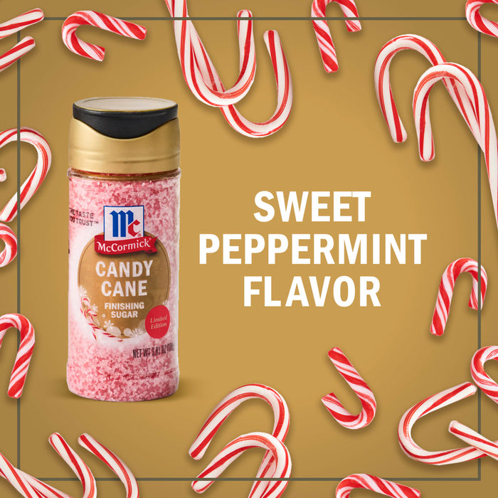 A jar of McCormick Candy Cane Seasoning is surrounded by candy canes, highlighting its sweet peppermint flavor.