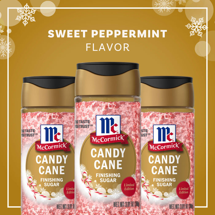 A jar of McCormick Candy Cane Seasoning is surrounded by candy canes, highlighting its sweet peppermint flavor.