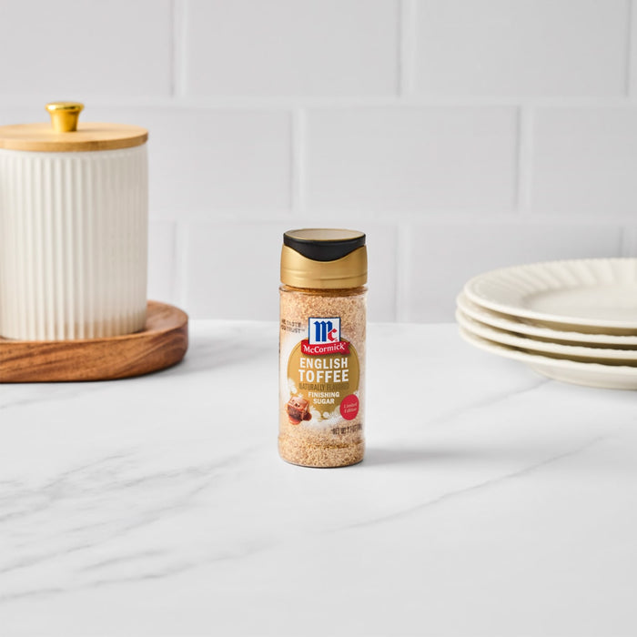A bottle of McCormick Grill Mates Montreal Steak Seasoning sits on a white countertop.
