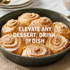 A pan of freshly baked cinnamon rolls with a glaze, suggesting they can elevate any dessert, drink, or dish.